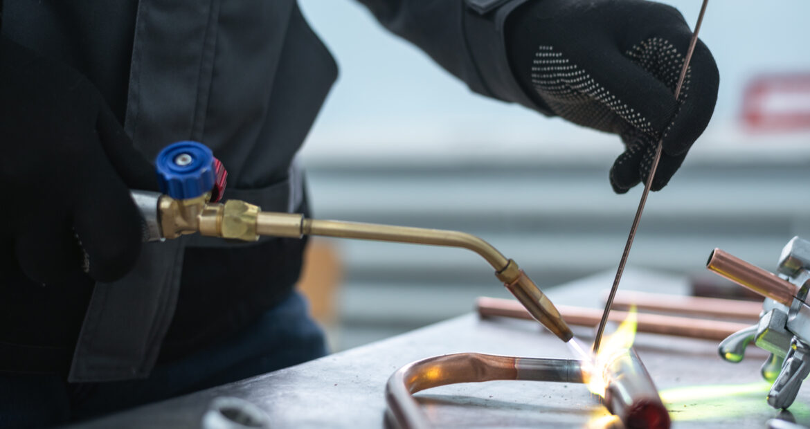 Worker,Is,Soldering,A,Pipe,By,A,Blow,Lamp,On